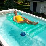 Woman Lounging in Swim Spa with FROG @ease